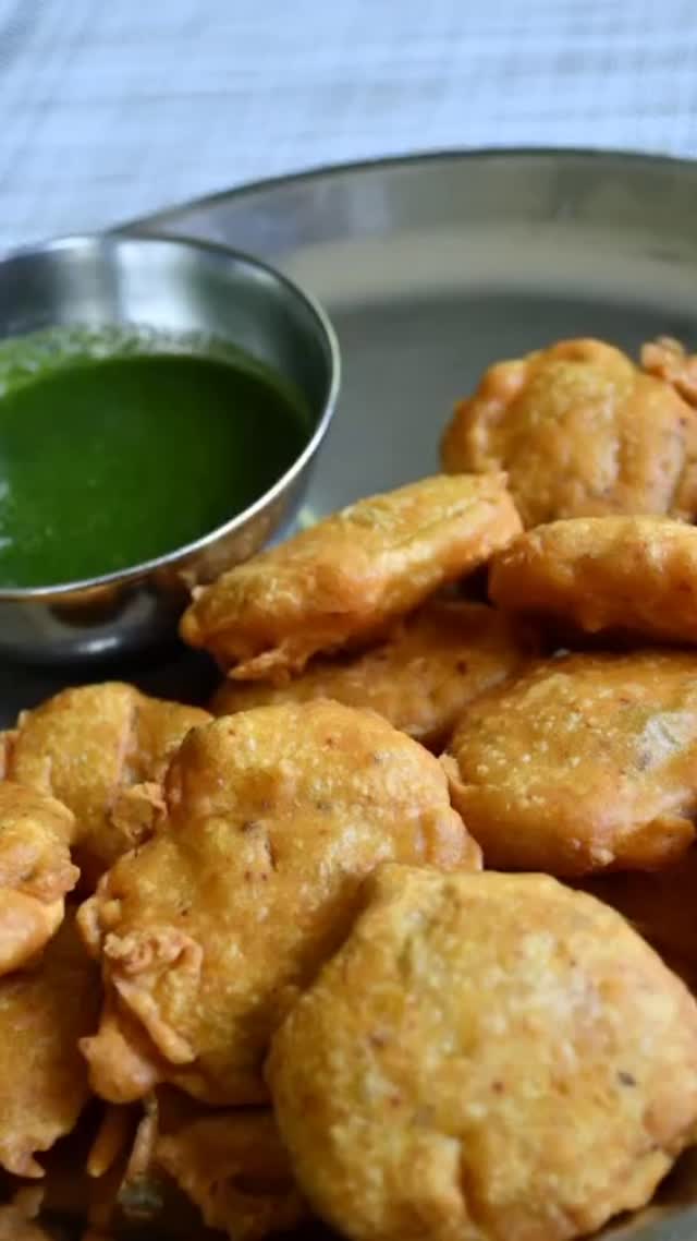 #Aloo pakora#appetizer#In winter time, especially during rainy periods, nothing can beat eating hot pakoras with chai.  Aloo pakoras, also known as potato bhajji or aloo bhajji are a popular snack made with potatoes, besan (gram flour) and spices. These are crunchy from outside, soft from inside with the taste of potatoes and spices. It is quick to make, almost all ingredients are available in our pantry and are delicious to taste. 

Ingredients 
2 cup besan (gram flour)
1 tsp Carom seeds (ajwain)
2 tsp green chili paste (adjust to taste) 
1 tbsp ginger, garlic paste 
2 tsp red chili powder (adjust to taste) 
1 tsp turmeric powder 
3 tsp salt (adjust to taste) 
Chaat masala - for garnish (optional) 
Oil for frying 
5 medium size potatoes - Half boiled, cut into slices, (Preferably boiled  into a pot to avoid becoming super soft). 
2 tbsp chopped cilantro (optional)

Method 
Take a bowl and add besan (chickpeas flour), ajwain and 2 tsp salt. Mix and add I cup water, mix slowly, keep adding more water to make a mix with thick consistency. Keep aside for about 15 to 20 minutes. 
Take another bowl and add potato slices, 1 tsp salt, 1 tsp red chili powder and cilantro.
Add 1 tsp red chili powder, ginger garlic paste, turmeric powder and  green chili paste to besan  batter and mix. 
Add oil to a wok and put on medium heat.  Wait for oil to get heated.
Add one potato slice and dip into the besan batter and  drop in heated oil. Repeat till the oil surface in the wok is full and not too crowded.
Flip at regular intervals and fry until golden brown. Remove on a paper towel. 
Serve immediately with green chutney and chai. 

Note:
Batter should have thick consistency and mix well to make crispy and fluffy pakoras. 
When you drop batter coated slices in oil, do not touch them for 20-30 seconds, to make fluffy pakoras. 
Store in the fridge for upto 2 days. Air fry or heat in the oven for 5 minutes at 375 F before serving. 
Potatoes can be sliced without boiling but I like half boiled potatoes.

If you like my recipes, see my cookbook on Amazon .
Mudita’skitchen.