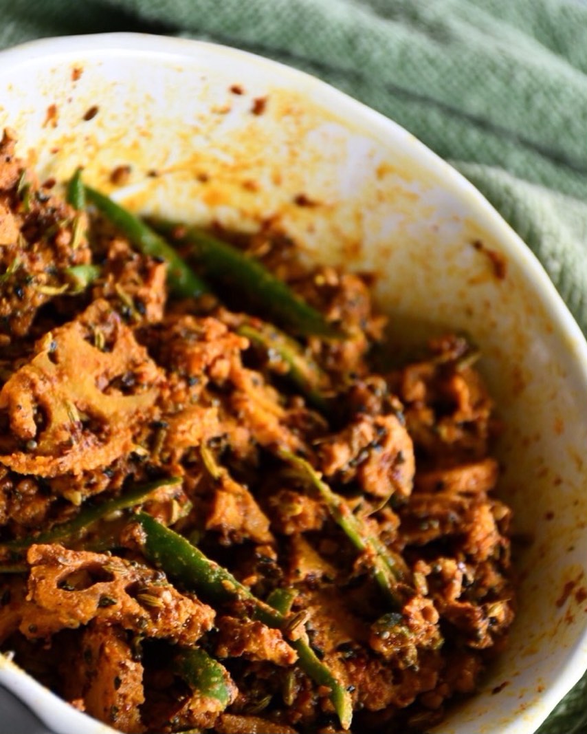 #kamalkari#pickle#It sounds weird to prepare achaar from kamal kakri (lotus root), but it is really tasty and crunchy in texture. 
Lotus roots are consumed as a vegetable in Asian countries, extensively in China, Japan, and India: sold whole or in cut pieces, fresh, frozen or canned. It has crunchy texture with sweet-tangy flavours, These are also promoted have purported diuretic, antidiabetic, and anti-inflammatory properties
Although traditional pickle is not considered healthy, lotus root pickle may give some mental satisfaction that you are eating a healthy vegetable.
Ingredients
Makes 1 medium bowl 
1 cup kamal kakri (lotus root) - washed, peeled and cut into small chunks 
¼ cup green chili - cut into thin slices 
⅓ cup turmeric powder 
2 tbsp red chili powder (adjust as per taste)
2 tsp Kashmiri mirch - for color 
2 tbsp kalonji (Nigella/ Black seeds)
½ cup mustard oil
3 tsp mustard seeds 
2 tbsp methi (fenugreek) seeds 
2 tbsp amchoor powder (dried mango powder) 
2 tbsp fennel seeds 
1 tsp hing powder
⅓ cup salt (adjust as per taste)
Method
Boil water in a pan, add lotus root chunks, take it out after about a minute, strain out the water and keep aside.
Add salt and turmeric powder to the lotus root chunks, mix it and keep for a 1 day. If possible, keep outside in the sunlight.
Drain out any water, and spread the pieces to dry out (for about 5-6 hours).
Dry roast fennel seeds, kalonji seeds, mustard seeds, fenugreek seeds for about 2 minutes on low heat then crush to a coarse powder.
Heat oil on low heat and add hing. Wait for 10 to 15 second. 
Now, Mix lotus root chunks, green chilli, roasted spices, other spices and oil. Transfer to a jar. Cover and keep in the sunlight for 3-4 days. 
Enjoy !