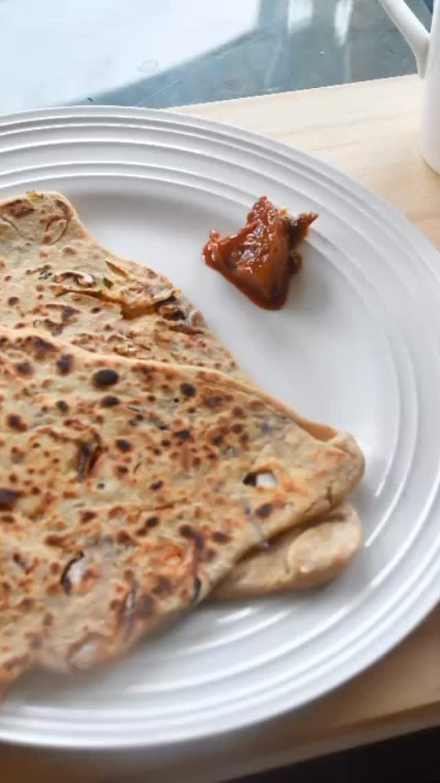 #cabbage#paratha#indianfood #parathalovers❤️ #These stuffed cabbage parathas are very easy to make and healthy as well since they are packed with vegetables. They are super yummy, and ideal to take to work/school for lunch since they are just as delicious without a curry. Moreover, they’re great to sneak in vegetables for the kids since you don’t notice the cabbage

Serves: 4 

Ingredients:
2 cups whole wheat flour - ½ cup for dusting
1 cup water 
1 tsp salt or to taste
1 tsp carom (ajwain) seeds 
Oil for roasting
For stuffing:
1 small cabbage - grated
1 small onion - finely chopped
2 green chilli - finely chopped
2 tsp cilantro - finely chopped
1 tsp red chilli powder
2 tsp salt or taste 

Method:
Take a wide dish and add flour, salt, and carom seeds. Mix together.
Add water slowly, and make soft but not sticky dough. Knead well, then cover and keep aside.
Meanwhile, add cabbage, green chilli, cilantro, red chilli powder and salt. Mix and keep aside. Add the salt when making the paratha if making in advance, otherwise the stuffing will become watery.
Put a fry pan or tawa at medium heat, and spread a little oil on it.
Make uniform balls (a little bigger than golf ball sized) of the dough. Take a piece and roll it out into a triangle shape (doesn’t need to be perfect, just generally).
In the center of the triangle, add stuffing, then fold each corner back into the center so the stuffing is inside. Roll out the dough again, but make sure it’s not too thin, otherwise the stuffing will come out.
Put the paartha on a fry pan and roast on both sides till golden brown, then spread oil on the paratha on both sides.
Serve hot or as you like with tea or curry and yogurt.
Enjoy!