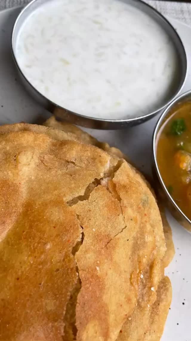 #During the celebrations of #Navratri (and some other festivals#devotees fast. Throughout this fasting period, people consume Kuttu (buckwheat). According to Hindu mythology, it is a strict NO for consuming grains during Navratri. Hence pseudo cereals such as kuttu or Singhara Ka atta(water caltrop/ chestnut) are consumed during this time. I have tried this recipe multiple times. It’s always so yummy.  It’s so simple and uses few ingredients we have in our  pantry.

Ingredients 
2 cups Kuttu (buckwheat)  or singhara (water caltrop) atta/  flour + ⅓ cup for dusting
3 medium potatoes boiled and mashed (fully mashed, not crushed) 
2 tsp black salt (or use any other salt) -  adjust to taste 
2 tsp black pepper - adjust  to taste 
 2 tbsp cilantro - finely chopped (optional) 
1 or 2 green chili finely chopped - adjust to taste (optional)
Oil for  deep frying
 

Method 
Take a wide bowl and add flour, potatoes, green chili, cilantro, salt and pepper.
Add about 1 tbsp oil and mix all ingredients 
Knead into a hard dough, add water as required and make a hard dough.
Apply oil on the dough surface, cover the dough and keep aside for about 5 minutes.
Add oil to a fry pan and put on medium-high heat
Apply oil to your palms and take a golf ball size piece of dough and roll it between palms
Spread flour dust on a flat surface and roll with a roller pin into a flatbread (Poori) about 3 inches in diameter. Apply flour dust as needed.
When oil is hot,  add poori and fry from both sides till golden brown.
Fry remaining pooris in the same manner. 
Serve with aloo sabji, chutney and dahi
Note: if the pooris break during frying,  add more flour to the dough and also make poori size smaller.
Some poori pop it  but some not because of cilantro and potatoes.
Very tasty and it is good for lunch and traveling.