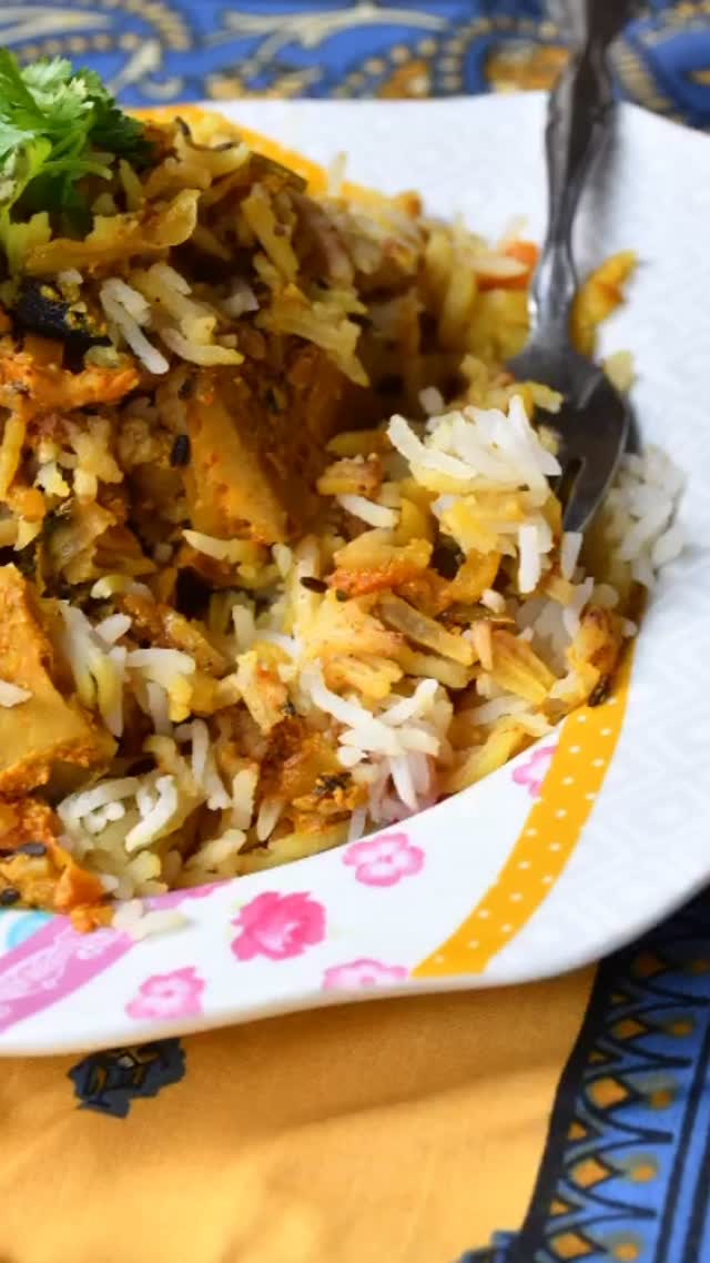 #jackfruitbiryani #jackfruitrecipes #rice#This recipe is great for both vegetarians and meat eaters, because the taste of the jackfruit is similar to that of meat! However, this recipe does require a fair amount of pre preparation#recipe on my website 

Serves: 4 

INGREDIENTS 
½ lb fresh kathal (green jackfruit) cut into small 1 inch squares (can used canned if fresh is not available)
1 ½ cup basmati rice, soaked for ½ an hour and drained
Salt to taste 
3 black cardamom 
4 green cardamom 
2 inch cinnamon stick
3 to 4 cloves 
2 star anises
Oil to fry
4 medium onions, sliced 
3 medium tomatoes, finely chopped 
1 ½ cup whisk yogurt 
4 tbsp ghee (clarified butter) 
1 tsp turmeric 
1 tsp red chilli powder 
1 tsp coriander powder 
1 tbsp grated fresh ginger 
1 tbsp minced garlic 
1 tsp jeera (cumin)
1 tsp cumin powder

For garnish 
2 tbsp fresh coriander leaves
2 tsp garam masala 
½ cup mint leaves 
¼ cup milk with saffron 
METHOD 
Biryani Mix
Preheat the oven to 400F.
First, take a sharp knife, and put oil on your hand and on the knife to prevent the jackfruit from sticking and cut it into small pieces.
Then, take a fry pan, heat oil, and fry the kathal (alternately you can shallow fry), and keep aside.
Deep fry half the onions and keep aside.
Remove the excess oil, add 2 tbsp ghee & cumin seeds and wait until crackling. Add 2 green cardamoms, 2 black cardamoms, star anise, 2 cloves and a 1 inch cinnamon stick.
Now, add the remaining onions and saute for about 2 -3 minutes. Add ginger & garlic and stir for about 1 minute. Add tomatoes and stir for about 2 minutes on medium heat. Add fried kathal.
Add salt to taste, red chili powder, turmeric powder, cumin powder, coriander powder, and yogurt and mix for about 2 minutes and keep aside.

RICE
Take 6 cups of water to a big pot and put at medium heat, and wait till the water starts boiling.
Add 2 green cardamoms, 1 black cardamom, 1 inch cinnamon stick, cloves, salt, and rice. Add a little oil so that the rice does not stick.