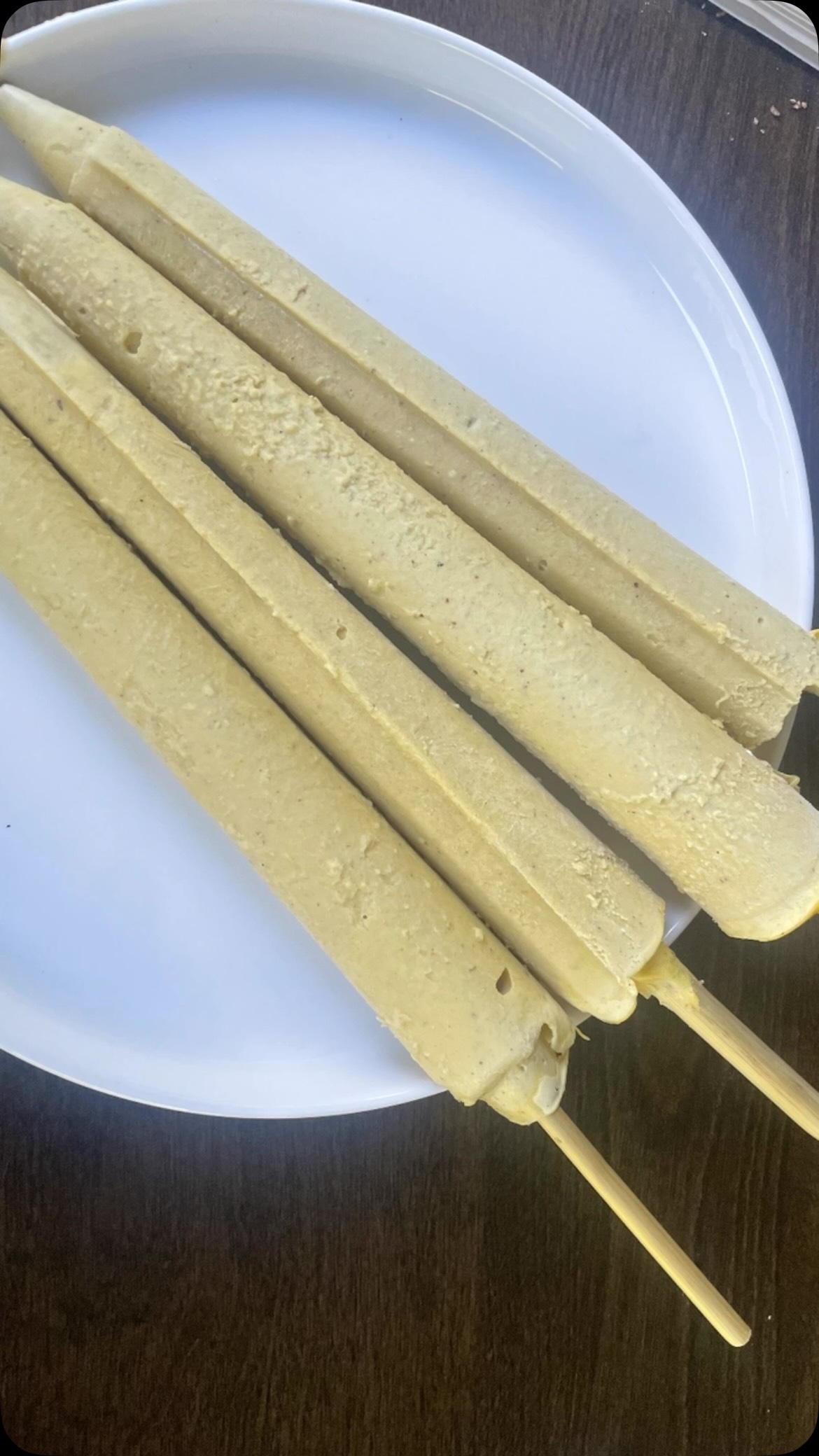 #mangoicecream🍨 #vartfoodrecipes👩‍🍳❤️😋✨️ #Mango Kulfi using Nuts is a luscious, no-churn Indian frozen dessert that beautifully captures the essence of summer. This creamy, dense twist on traditional kulfi—often hailed as India’s answer to ice cream—is infused with the vibrant, juicy sweetness of ripe mangoes.
I created a healthier version by incorporating high-protein ingredients like cashews, pistachios, cottage cheese, and paneer, while sweetening it naturally with monk fruit sweetener. The result? It tastes even better than classic kulfi—rich, indulgent, and satisfying—while delivering a generous boost of protein and avoiding any sugar spike.#day 4 ideas for fasting - samak rice and sweet potato chaat and nuts 
 

Ingredients 
1 cup  cashews (kaju)
½ cup pistachios (pista)
1 cup cottage cheese 
1/ 2 cup paneer
1.5 cup mango chunks/ puree 
2 tsp Monk fruit sweetener 
1 tsp cardamom  powder 
Few strands of saffron 
1.5  cup milk 

Method 
In a large bowl, combine the cashews, pistachios and saffron. Pour  milk on top and keep in the fridge for overnight or 6-8 hours.
Add everything in a blender and blend until you get smooth and creamy paste.
Pour the mixture into kulfi moulds or ice cube trays or a small container and tap to remove any air bubble. 
Freeze for 8 hours or until firm.
Enjoy frozen or let it sit for a few minutes and serve as a soft creamy dessert 

Note: 
Optionally, add almonds.
Adjust sweetness depending on your taste and mango ripening.
For a richer texture, add little cream before blending.
See more recipes on my cookbook on amazon