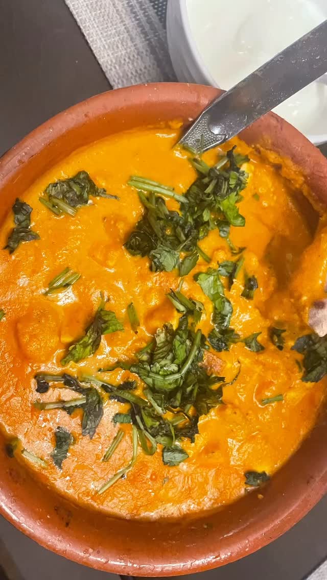 #butterpaneermasala❤️ #Butter paneer masala, also known as paneer butter curry is a luxurious Indian dish. Prepared with butter, tomato and cashew gravy,  it is mildly spiced and balanced with a hint of sweetness using cream. It goes well with roti, paratha or rice. Its vibrant flavor and velvety texture makes it one of most loved vegetarian curries in Indian cuisine. 

Serves 2 people 

Ingredients 
1 1/2 cups paneer - cut into cubes 
½ cup bell peppers cut into pieces - optionally use mix of  green, red and yellow peppers 
¼ cup cream (or whole milk for lighter version) 
Fresh coriander leaves - chopped (for garnish) 

For gravy 
3 tbsp butter 
2 tbsp oil for gravy and + 1 tbsp oil for paneer shallow frying 
1 large onion - chopped 
3 to 4 medium tomatoes - chopped 
10 cashews soaked for 10 minutes 
1 tsp ginger and garlic paste 
2 green chilies - chopped

Spices 
1 tsp red chili powder 
½ tsp turmeric powder 
1 tsp coriander powder 
1 tsp garam masala
1 tbsp Kasuri methi 
1 bay leaf 
Salt to taste 

Method 
Add 1 tbsp oil to a frypan  and put on medium heat. Wait until oil is hot.
Add paneer, Stir every 30 seconds till paneer is roasted evenly.
Add bell pepper and stir for 2 or 3 minutes. Keep aside.

Gravy: 
Add 1 tbsp oil and 2 tbsp butter to another pan and put on medium heat. Wait till butter melts.. 
Add onion, tomatoes, green chili and soaked cashews. 
Mix together and wait until everything is tender (not necessary to completely cook, just tender for about 5 minutes).
Make into a paste in the blender. 
Add 1 tbsp oil and 1 tbsp butter to a pan and put on medium heat. Wait for butter to melt. Add ginger - garlic paste and bay leaves, mix and wait for 30 seconds 
Add gravy mix and cook for 3 to 5 minutes or until the gravy is consistent and oil comes out.
Add all dry spices except garam masala and kasuri methi.
Add paneer and bell peppers. Mix well. 
Lastly add milk or cream, kasuri methi and garam masala 
Garnish with coriander leaves 
Serve hot with roti, paratha  or jeera rice!
Enjoy