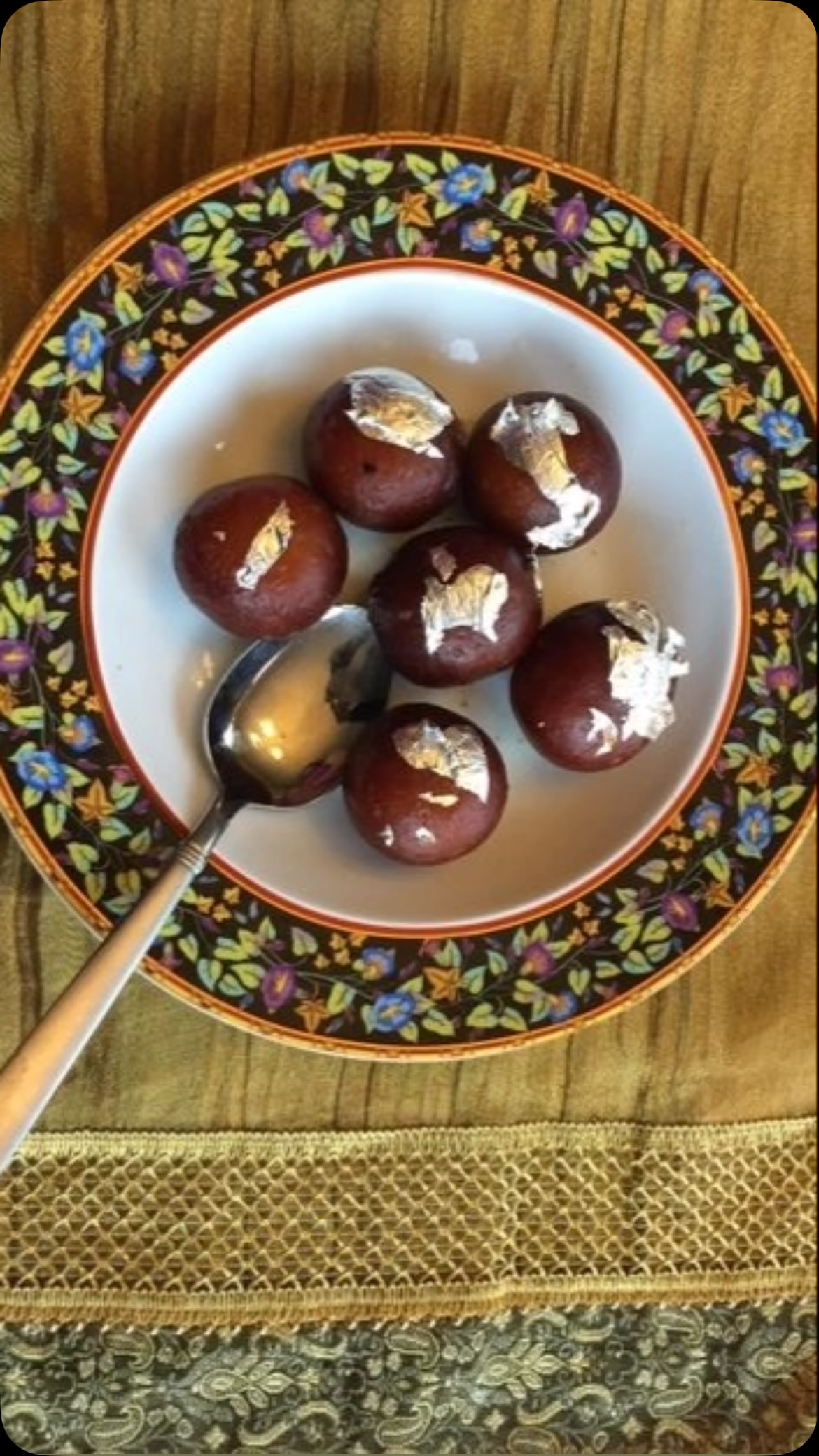 #Festival Gulab Jamuns

Festival season is the perfect time to enjoy delicious homemade sweets! Here’s an easy recipe for soft, flavorful gulab jamuns that everyone will love. ❤️

Ingredients

* 1 cup pancake mix
* 2 cups whole dry milk powder
* 1 cup whole milk
* 3 tbsp butter, melted
* 2 cups sugar
* 2 cups water
* 5–10 strands saffron
* 1 tsp cardamom
* 2–3 drops rose water
* Oil, for deep frying

Method

For the Sugar Syrup:

1. Add water and sugar to a wide pan.
2. Bring to a gentle boil and cook for 5–10 minutes, stirring occasionally.
3. Add saffron, cardamom, and rose water.
4. Turn the heat to low and keep the syrup warm.

For the Dough:

1. In a bowl, mix the pancake mix, dry milk powder, and melted butter.
2. Gradually add the milk and knead until you have a soft dough. If the dough feels dry, add a little more milk.
3. Cover and let the dough rest for 15 minutes.
4. Knead again until smooth.
5. Take a small portion of dough and roll it into a smooth ball about 1.5 cm in diameter. Make sure there are no cracks, or the gulab jamuns may break while frying.
6. Repeat with the remaining dough.

For Frying:

1. Heat the oil over medium heat to about 325°F (165°C).
2. Carefully deep-fry the gulab jamuns until golden brown and cooked through, about 15–20 minutes.
3. Remove them from the oil and immediately place them into the warm sugar syrup.
4. Let them soak for at least 1 hour so they become soft and juicy.

✨ Your delicious homemade gulab jamuns are ready to enjoy with family and friends!

Serving idea: For a delicious twist, serve warm gulab jamuns with a scoop of vanilla ice cream. 🍨❤️