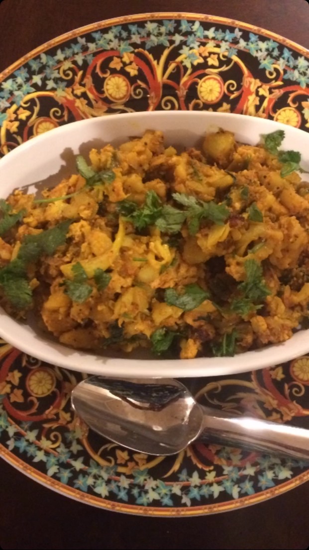 #khoyagobhi#Khoya gobhi is a very rich curry,  making it very easy and tasty. 
Ingredients
1 Head cauliflower (gobhi) medium size - cut into small florets
½ cup khoya - grated (dried milk mass) 
2 tsp coriander powder
1 tsp turmeric powder
2 tsp red chilli powder or to taste
1 tsp cumin seed
1 tsp amchoor powder
Salt to taste
1/3 tsp hing
1 tsp garam masala
2 green chillies - finely chopped 
2 tbspcoriander leaves - finely chopped
1 tsp ginger - finely chopped
2 tbsp oil
Method

Take a heavy pan, put it on the stove at medium heat, and add oil. When the oil is heated, add cumin seeds with hing. Wait until cumin seed crackles. Add cauliflower,  turmeric and salt. Stir.  Cover the lid and wait for about 2 minutes. 

Now add coriander powder, red chilly powder, green chillies & ginger and mix. Stir and cover with  lid for about 2 minutes and let it cook at slow heat. 

Stir often, otherwise it may burn. Open the lid and check if the water has evaporated. When cauliflower is tender,  add khoya and  mix then add garam masala and amchoor powder. Mix to the curry.

Season with coriander leaves and serve with naan, roti or paratha.
How to make khoya :

You can make a quick version of khoya (mawa) using milk powder and condensed milk. It’s soft, rich, and works well for sweets like gulab jamun, barfi, peda, and gujiya.
Quick Khoya Recipe
Ingredients
2 cups milk powder
½ cup sweetened condensed milk
2 tablespoons ghee
2–4 tablespoons milk (if needed)
Instructions
Heat the ghee in a nonstick pan over low heat.
Add the condensed milk and stir until warm.
Gradually add the milk powder while stirring continuously to avoid lumps.
Cook on low heat for 3–5 minutes, stirring constantly. The mixture will thicken and begin to leave the sides of the pan.
If it seems too dry, add 1 tablespoon of milk at a time until it reaches a soft dough-like consistency.
Remove from the heat and let it cool. It will firm up slightly as it cools.
Tips
Since condensed milk is already sweet, this khoya is sweeter than traditional khoya. Reduce the sugar in any recipe that uses it.
For a richer flavor, add ¼ teaspoon cardamom powder or a pinch of saffron while cooking.