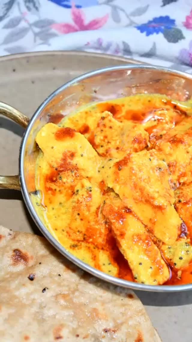 #curry#Pitod ki Sabzi is a traditional #recipeon👇🏾 #Rajasthani dish. This is similar to gatte ki sabzi but more delicious and tastes similar to paneer ki sabzi, but does not use any vegetable or paneer. Rajasthan is a desert state with little vegetation and that is why  people are accustomed to using fresh vegetable alternatives. If there are no vegetables in your fridge and you still want to make something special then do prepare Rajasthani Pitod ki Sabzi.Serves: 4

Ingredients 
1 cup gram flour (besan flour)
2 cups sour curd (dahi)
4 tbsp oil
2 pinch hing (asafoetida) 
2 tsp jeera (cumin seeds)
2 tsp grated ginger 
2 tsp red chili powder 
2 tsp turmeric powder 
2 tsp coriander powder 
½ tsp garam masala 
2 green chili - split 
Salt to taste 
2 tbsp cilantro/ coriander leaves garnish 
Method 
Sift besan in a deep bowl. Add salt to taste and mix
Add 1 cup curd. Mix well 
Add 2 cups of water and mix using a whisker and make sure there are no lumps remaining
Add 1 tsp red chili  powder, 1 tsp turmeric powder and 1 tsp coriander powder and mix again
Put a large karahi on medium heat and add 2 tbsp oil in it. Add 1 tsp cumin seeds when the oil is hot. Add a pinch of hing when cumin seeds crackle
Add the besan batter and cook on a high flame, until a boil. Make sure that you stir continuously with a spoon. Else it will stick to the bottom
Lower the flame to medium-high and cook the batter until it is a little thick (4-5 minutes) 
Meanwhile, take a large plate and grease it Well. Transfer the batter to this greased plate
Using the spatula, spread the thickened batter evenly and let it set till it is solid (about 20 - 25 minutes)
Take a sharp knife and cut it into diamond shapes and keep aside 
Put another pan on medium heat and add 2 tbsp oil. Once the oil is hot, add remaining spices , hing jeera and split green chilies.add remaining dhai to the pan stir for about 3 minutes on slow heat.
Add all remaining spices and mix add salt to taste and 1 cup water or more if needed.
Keep on slow heat and wait for another 4 to 5 minutes. Add garam masala.
Now there are two ways to enjoy this dish the first one is to add the diamond pitod in the curry and cook more 3 minutes. O