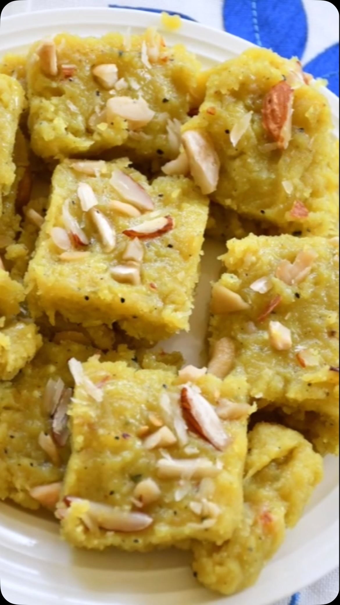 #laukibarfi #sweet#This dessert is truly amazing! This time, I tried to make something healthier, so I came up with this lauki barfi. It sounds odd, but try this unique recipe out - somehow it works and tastes delicious! This would also be great if you are fasting.

Ingredients: 
1 medium size lauki, no seeds 
½ cup dry milk powder
½ cup dry almond flour 
½ cup sugar or to taste
2 tbsp ghee or unsalted butter
A few flakes saffron
1 tsp cardamom powder
For garnish - pistachio, cashew and almond - sliced
Method:
Peel and grate the lauki and press out the water, then keep aside.
Meanwhile, take a cup and add 2 tbsp milk and saffron, then keep aside.
Start a wok or pan on medium low heat and add ghee or butter and wait for a minute. 
Add lauki and roast for 10 minutes or until the pan is not sticky. Stir often.
Add milk powder and almond flour and mix, then add cardamom powder and mix again.
Now add sugar, stir everything very well then add saffron and mix for a minute.
Take a tray and spread ghee, then add the lauki mixture. Wait for 5 minutes.
Garnish with pistachio, cashew and almond. Keep in the fridge for 6 - 8 hours or overnight.
Cut in slices and serve this unique sweet dish.

Note: If the barfi is a little soft, add 2 tbsp corn flour or add more dry milk, then keep in the fridge.