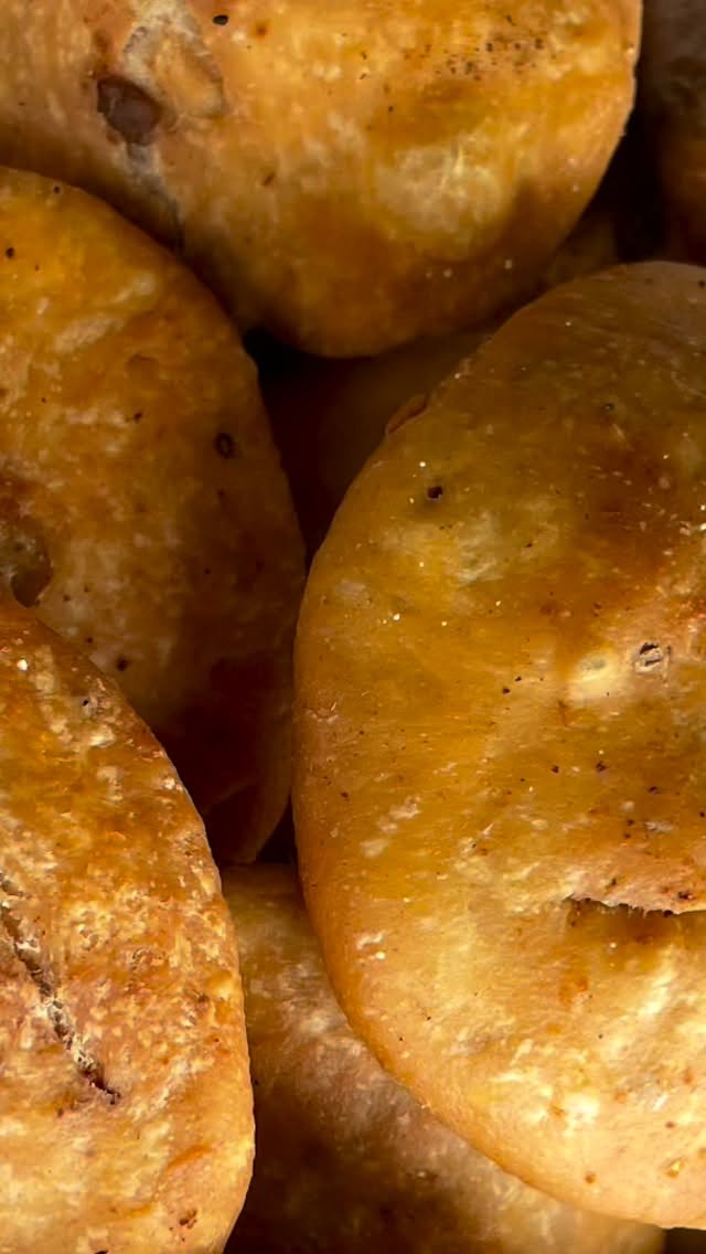 There is no better #Indian snack than #Khasta Kachori#Crispy shells stuffed with lentils and spices provide a unique taste and texture. This is a very authentic recipe for khasta kachori, you can store it for about 1 week and enjoy any time with tea or coffee.

INGREDIENTS 

 Serves: 6 
2 cup all purpose flour 
½ cup ghee 
1  tsp salt (adjust to taste)
½ tsp ajwain ( carom seed) 
water for kneading into dough

Filling 
1 cup moong  dal soaked for about 3  hours or overnight 
1 tsp salt (adjust to taste) 
2 tsp crushed fennel seed 
2 tsp red chili powder (adjust to taste) 
2 tsp amchoor powder (Dried mango powder)
1 tsp ginger powder 
1 tsp hing 
½ cup besan 
1 tsp cumin seed 
1 tsp garam masala 
2 tsp oil plus additional oil for frying

Method 

Dough

Take a bowl and add flour, salt, ajwain (Carom) and ½  cup oil. 
Mix and make a hard dough with water. 
Let the dough sit for about an hour
Separate the dough into 16 equal sized pieces 

Filling 

Grind soaked dal in a food processor, so that it is little granular and not fine paste.
Take a wok or fry pan and put on slow - medium heat.
Add 2 tbsp oil and wait until hot, add cumin seed and hing. 
When crackling starts, add dal and stir for about 15 minutes (or more until dry).
Add red chili powder, salt, fennel seed, ginger powder, amchoor powder and garam masala. Stir for a couple of minutes.
Let it cool for about ½ hour or more. Grind in a food processor to remove chunks, if required.
Roll one piece of  dough (about 2 inch diameter) and add about 2 tbsp of dal mixture. Fold well, seal  and roll again ensuring the filling does not come out. Repeat the process till you have rolled all Kachoris.
Let the Kachori sit out and dry for about ½  hour. 
Heal oil in a fry pan or a deep fryer on medium heat 
When oil is hot, reduce the heat and fry the kachoris until golden on both side
Make all kachori in the same manner.
Serve with any chutney!
Enjoy!