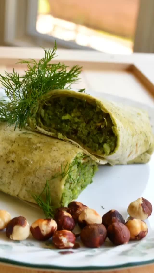 #My favorite part about these wraps is that we can make them the day before - they’re great for work/school, travel, or for a summer picnic! These wraps are delicious, yet easy to make and healthy#wrap#vegeterian #pesto#healthy

Ingredients

Serve: 2 

1 cup quinoa
2 cups vegetable stock
Sea salt and black pepper to taste
½ cup hazelnut
1 small garlic clove
½ tbsp lemon zest
¼ cup fresh basil 
½ cup extra virgin olive oil
½ cup dried apricots cut into small pieces
2 spinach wraps or large flour tortillas
Hummus 

Method

Put the quinoa in a mesh strainer and rinse under warm running water for about 3 minutes to remove the bitter outer coating.
Put a small saucepan on high heat, add the quinoa, vegetable stock and salt to taste,  and wait until it boils.
Then, put the heat at medium-low, cover and simmer until most of the stock is absorbed, for about 15 to 20 minutes.  Remove from the heat and let sit, covered, for about 5 minutes or more as required.
Meanwhile, preheat the oven to 275 F.
Spread out the hazelnuts in a single layer on a baking sheet and bake until toasted.
Stir often to keep them from burning, for about 5 to 7 minutes.
Rub the hazel nuts with a paper towel until most of the skins have rubbed off. It should take about 30 seconds or so.
Then, chop the nuts and add the half of them to the food processor, and set aside the remaining half. Add basil, garlic, lemon zest, and olive oil to the food processor and pulse until a thick pesto forms, about 30 seconds, then add salt and pepper.
In a large bowl, combine the cooked quinoa, hazelnuts, pesto, and apricots and toss together.
Then, serve time: if you like hummus, spread on the tortilla first, and then spread the mix onto the tortilla, and serve.
Enjoy!!

.