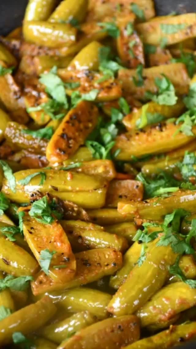 #This is a delicious dry curry! Tindora is a small green colored vegetable which looks like a baby cucumber. It’s a crunchy, low calorie, and high fiber vegetable. The curry goes with roti, yogurt and rice, and even sambar#sabji#indian food#tindora .

Ingredients:
Serves: 4
250 gm tindora/ivy gourd (can be found in Indian stores) - washed and chopped
1 tsp cumin seeds
3 to 4 dry red chilli
1 to 2 green chillies - chopped
1 pinch hing/asafoetida
½ tsp haldi/turmeric powder
½ tsp red chilli powder
½ tsp garam masala
1 tsp coriander powder
1 tsp salt or to taste
1 tsp lemon juice or 1 tsp amchoor powder
1 tbsp oil
For garnish, 2 tbsp chopped cilantro 

Method
Take a wok or a fry pan and add oil, then put on medium heat. Wait until the oil is hot.
Add cumin seeds, hing/asafoetida and wait until the seeds crackle. 
Now add dry red chili and green chili. Stir 30 seconds and add tindora.
Stir everything and add the dry spices - salt, turmeric, red chili powder, and coriander powder. 
Mix very well, and cover the pan for about 10 to 15 minutes on slow heat or until the tindora is tender. 
Mix often so that the tindora doesn’t burn. Add lemon juice or amchoor powder and garam masala. Mix and wait for a minute. Now turn off the heat.
Cover for about 2 - 4 minutes. Garnish with chopped cilantro.
Enjoy!