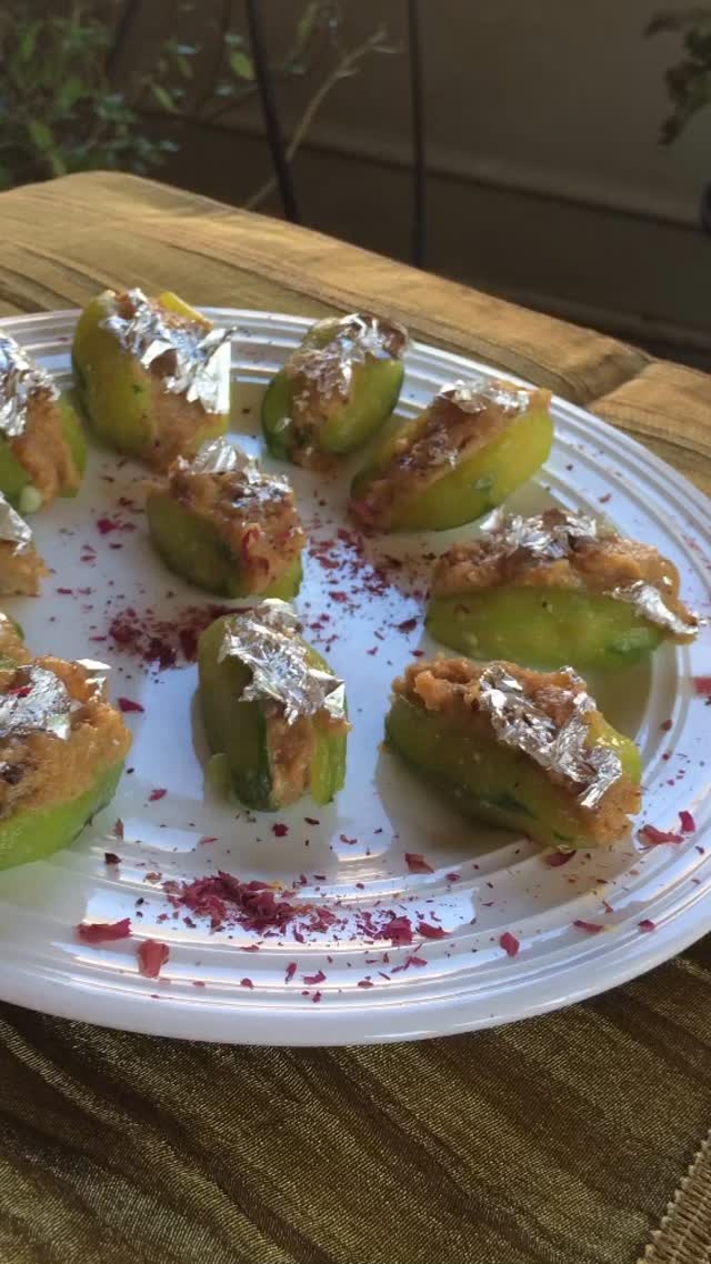 #parwalkimithai #sweet#parwalrecipe #This sweet dish is very unique, colorful, and appealing!

Ingredients:

Serves 6 
10 to 12 fresh parwals - peeled 
½ cup khoya 
1½ cups sugar
2 tbsp almonds - finely chopped
2 tbsp cashews - finely chopped
1 tsp cardamom powder 
A few pieces chandi varak

Method 
First, take a wide pan and add 1 cup sugar with 1 cup water. Next, put on the burner on medium heat.
Cut halfway through the middle of the parwals and steam for about 3 to 5 minute. Make sure that the parwals do not break. 
Now, add the parwals to the sugar syrup. Wait for about 5 minutes.
Meanwhile, take the khoya and add ½ cup sugar or to taste, cardamom powder, almond, and kaju.
Leave the parwals in a strainer for about 5-10 minutes. Then, refrigerate for about ½ hour. 
Stuff the parwals with the khoya mix. 
Decorate the chandi varak.
Now, keep the parwals in the refrigerator for about 1 hour. 
Enjoy! Serve cold. 
note: make before a day and keep  the fridge overnight ,  use next day , more flavor comes.