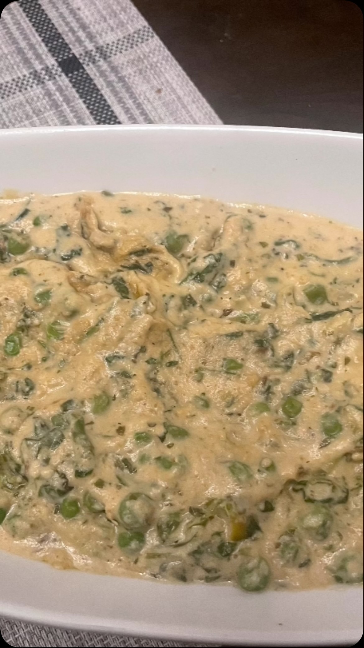 #methi malai mater#Methi Malai Matar is fenugreek leaves and peas cooked in a mild and creamy gravy. It is one of those dishes that feels indulgent yet comforting — creamy, mildly sweet, aromatic, and beautifully balanced. A perfect North Indian classic for a relaxed evening. Served with a choice of Indian flat bread like roti, chapati, paratha, naan or even rice.

Here’s a simple, restaurant-style Methi Malai Matar recipe you can make at home very easily 

🌿 Methi Malai Matar Recipe
🥘 Serves: 3–4
🧾 Ingredients
1 cup fresh methi leaves (washed & finely chopped)
1 cup green peas (fresh or frozen)
2 tbsp oil or ghee
1 tbsp butter (optional, for richness)
1 tsp cumin seeds
1 medium onion – finely chopped
1 tsp ginger paste
1 tsp garlic paste
2 tbsp cashew paste (soaked & blended)
½ cup fresh cream (malai)
½ cup milk (to adjust consistency)
½ tsp turmeric powder
1 tsp coriander powder
½ tsp garam masala
Salt to taste
1 tsp sugar (optional, balances bitterness)

 Method
Heat oil/ghee in a pan. Add cumin seeds and wait till it crackles.
Add chopped onion and sauté until soft and light golden.
Add ginger and garlic paste, sauté till the raw smell goes away.
Add turmeric and coriander powder. Mix well.
Add cashew paste and cook for 2–3 minutes on low heat.
Add green peas and a little milk. Cover and cook till peas are soft.
Add chopped methi leaves, salt, and sugar. Cook for 3–4 minutes.
Lower the heat, add fresh cream and remaining milk. Mix gently.
Sprinkle garam masala and butter (optional). Simmer for 2 minutes.
Switch off heat. Do not boil after adding cream.
serve with Naan, paratha.