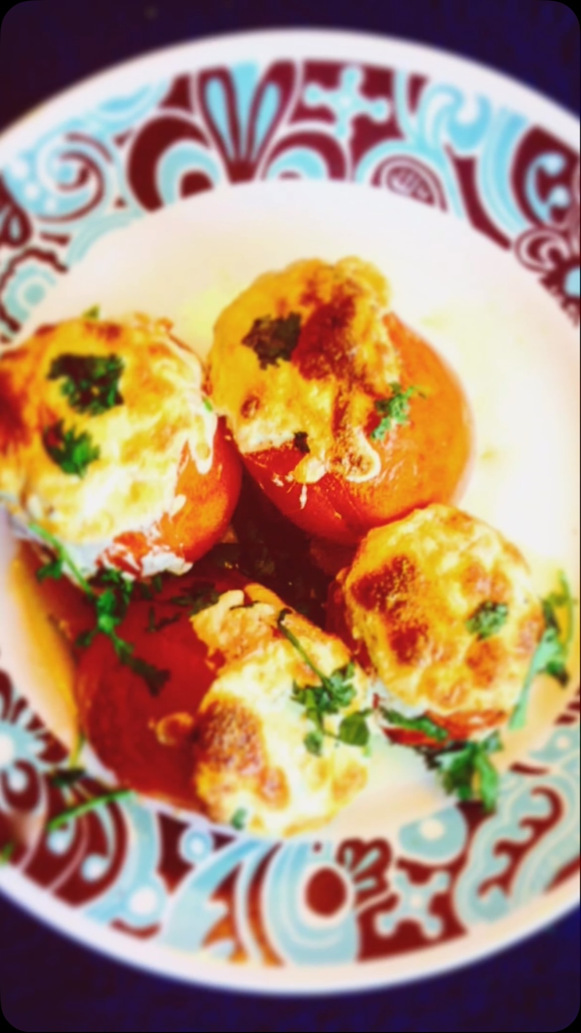 #stuffed tomatoes #It is a very amazing and elegant dish#appitizer #tomatorecipe 
Ingredients

1 pound firm tomatoes try Roma tomatoes 
1 cup paneer - grated
1/4 cup khoya - grated
Salt to taste
2 tsp garam masala
1/2 cup mozzarella cheese - grated
2 tsp black pepper
Method
First heat the oven to 450 F degrees. Another way to bake is to take a pan with oil and put it on low heat, but the oven is preferred.
Remove the tomato pulp with a sharp knife or a melon baller, which is easier. Do not break the tomatoes.
Stuffing
Mix the paneer, khoya, salt, and garam masala, and black pepper in a bowl. Mix well.
Take a tomato and stuff it with the mixture you just made. Cover the top with the mozzarella cheese. Stuff all the tomatoes in the same way.
Bake the tomato for 5 to 8 minutes until they are golden in color, tender and the cheese is melted.
Garnish with coriander leaves. Serve hot or room temperature either alone as a snack or with chapati.