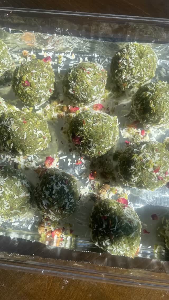 #paanlovers #paanladu #sweet#Paan Laddu is a delicious, elegant, quick and rich dessert made with Paan leaves, gulkand, condensed milk and coconut. Fresh Paan leaves and gulkand provides an authentic paan flavor and will wow your guests.

Ingredients 
Serves 8
½  cup condensed milk
4 paan leaves
1-1/2 cup coconut powder 
⅓ cup Gulkand 
Nuts (optional)
Rose Petals 
Ghee 
Food color - Green 

Method 
Add condensed milk and paan into a food processor or grinder and grind for about 2 minutes till leaves are crushed (Do not make a paste)
Add 2 or 3 drops of green color and turn the grinder for a few seconds to mix. Keep aside.
Put a pan on slow heat and add 1 tbsp ghee. Add 1 cup coconut powder when the ghee has melted. Keep stirring and roast for about 1 minute on very low heat otherwise the coconut will burn. Keep aside.
Put another pan on slow heat and add condensed milk, paan mixture and mix until thick (about 3 to 5 minutes). Remove from heat.
Add roasted coconut into the condensed milk- paan mixture and mix well to make a dough. 
Mix ½ cup coconut and 2 tbsp rose petals in a bowl and keep aside. 
Divide paan mixture and divide into 8 equal parts. Take a part and roll it into a flat disc about 2 inch diameter using your palm. Add 1⁄2 tsp gulkand and nuts, if desired. 
Roll in your palms to make a laddu. Roll into coconut - rose petal mixture and  keep it on a plate. 
Repeat to make the rest of the laddus and keep in the fridge for about ½ hour.
To serve, sprinkle coconut and rose Petals on top!

Note: You can cut laddu into 2 or 4 parts and serve.
It will be tastier if you make it on the previous day and serve the next day.
See similar recipes on my cookbook on Amazon