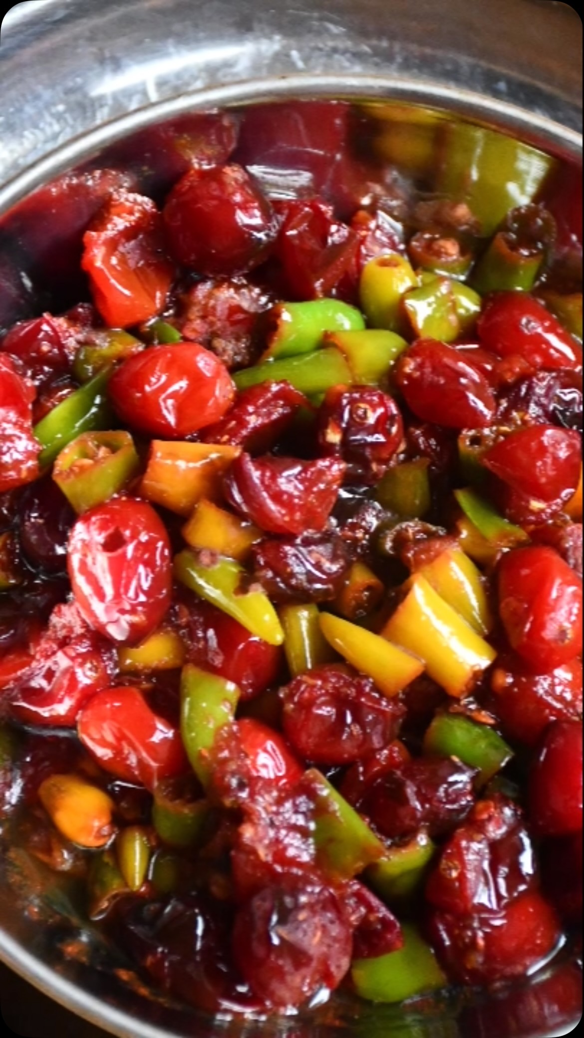 #cranbeery #green chili#Tangy Cranberry Mirch
A quick, flavorful side dish inspired by the traditional Indian karonda mirch. Fresh cranberries are cooked with green chilies and aromatic spices to create a delicious balance of tangy, spicy, and savory flavors. Enjoy it with chapati, naan, or as a side with any Indian meal.
Ingredients
	●	½ cup fresh cranberries, washed
	●	⅓ cup green chilies, finely chopped
	●	Salt, to taste
	●	1 teaspoon coriander powder
	●	½ teaspoon turmeric powder
	●	1–2 teaspoons oil
Instructions
	1.	Heat the oil in a pan over low heat.
	2.	Add the cranberries and chopped green chilies. Stir gently for a few seconds.
	3.	Add the coriander powder, turmeric powder, and salt. Mix well.
	4.	Cover and cook for about 30 seconds.
	5.	Stir once, turn off the heat, and let the pan remain covered for 2–3 minutes. The cranberries will soften while keeping some of their texture.
	6.	Serve warm with chapati, naan, or your favorite Indian meal.
Optional
	●	For extra heat, add more green chilies.
	●	For a sweet-and-spicy version, stir in 2 teaspoons of sugar just before turning off the heat.
Health Tip
Cranberries are rich in antioxidants and may help support urinary tract health. While they are not a treatment for infections, they make a nutritious and flavorful addition to your diet.
Ready!